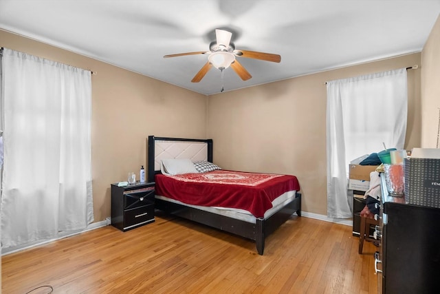 bedroom featuring light hardwood / wood-style floors and ceiling fan