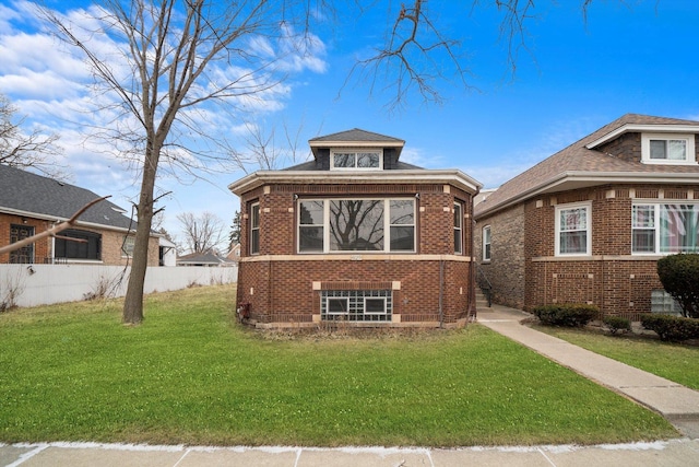 bungalow-style home featuring a front lawn