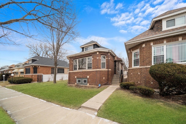 bungalow-style house with a front yard