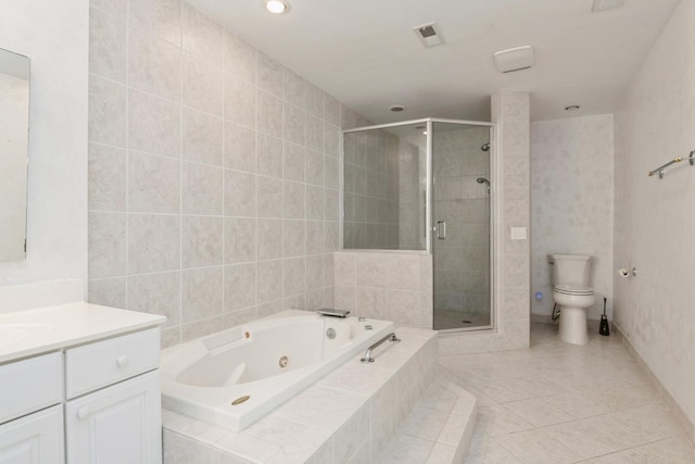 bathroom featuring tile patterned floors, toilet, a whirlpool tub, a shower stall, and vanity