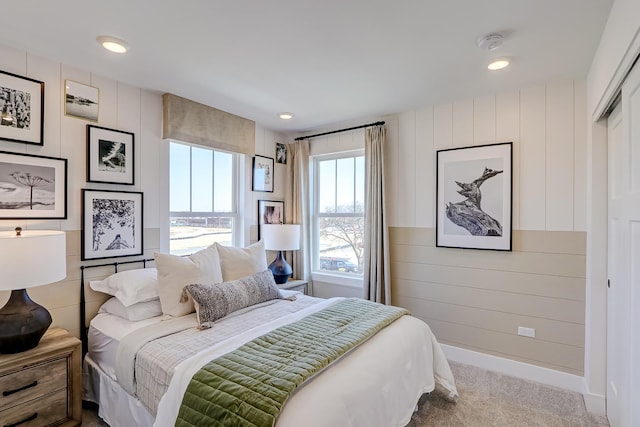 bedroom with light colored carpet