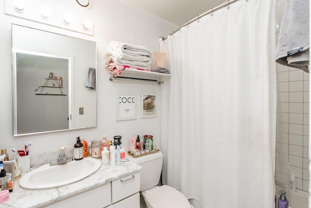 bathroom featuring vanity and toilet