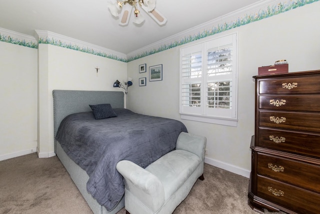 bedroom with ornamental molding and light colored carpet