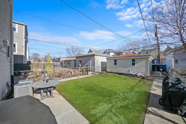 view of yard with cooling unit and a patio