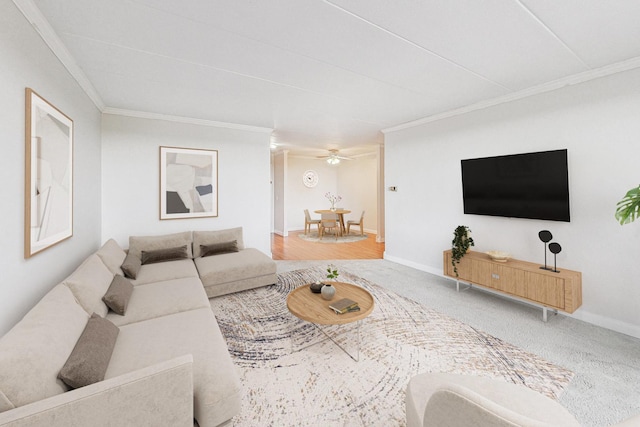 carpeted living room featuring ceiling fan and ornamental molding