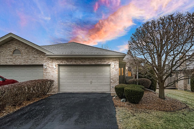 property exterior at dusk featuring a garage