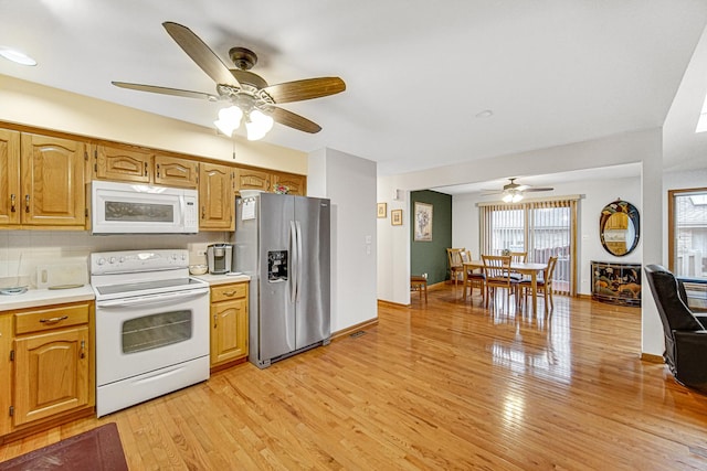 kitchen featuring white appliances, light hardwood / wood-style flooring, decorative backsplash, and ceiling fan