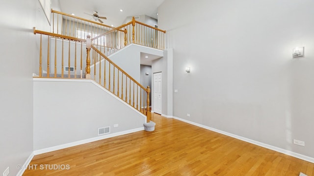 interior space with visible vents, baseboards, and wood finished floors