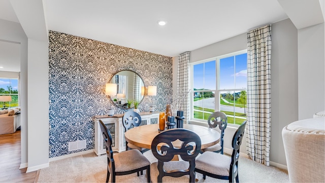 dining room with light carpet