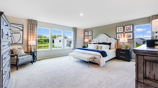 bedroom featuring light carpet