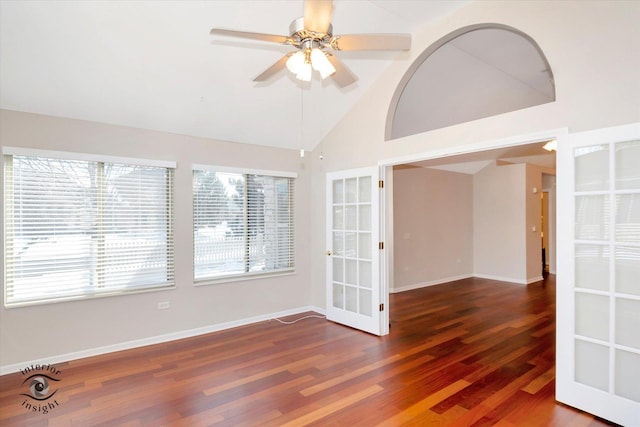 unfurnished room featuring dark hardwood / wood-style flooring, ceiling fan, and lofted ceiling