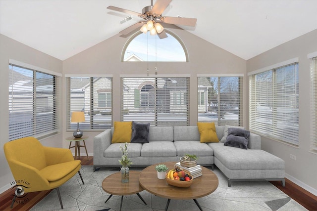 sunroom featuring vaulted ceiling and ceiling fan