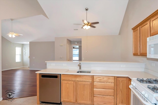 kitchen with white appliances, lofted ceiling, ceiling fan, light tile patterned floors, and sink