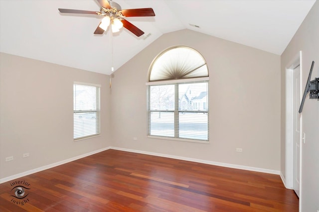 empty room featuring dark hardwood / wood-style flooring, ceiling fan, and lofted ceiling