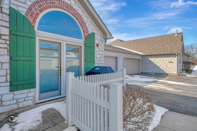 view of exterior entry featuring a garage