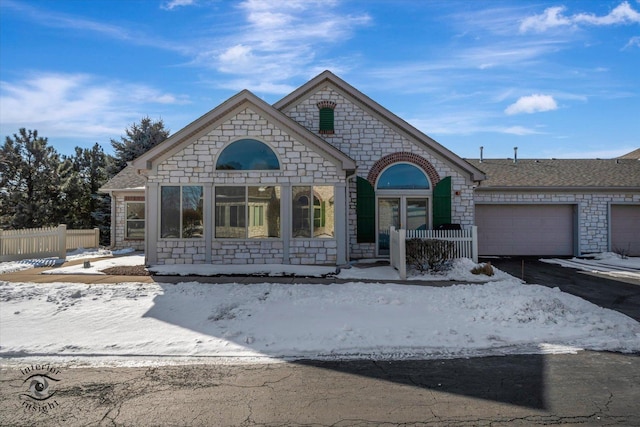 view of front of home with a garage