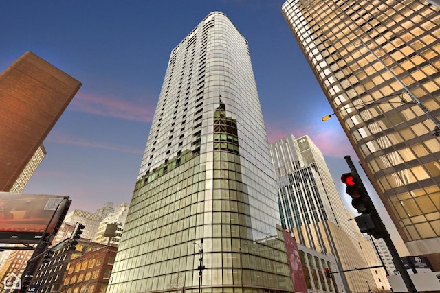 view of outdoor building at dusk