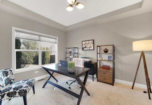 office space with an inviting chandelier, baseboards, visible vents, and light colored carpet