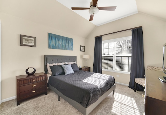 carpeted bedroom with lofted ceiling, ceiling fan, and baseboards