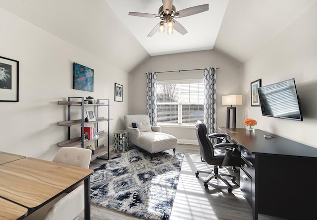 home office featuring a ceiling fan, lofted ceiling, and wood finished floors