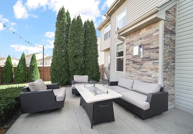 view of patio / terrace with fence and an outdoor hangout area