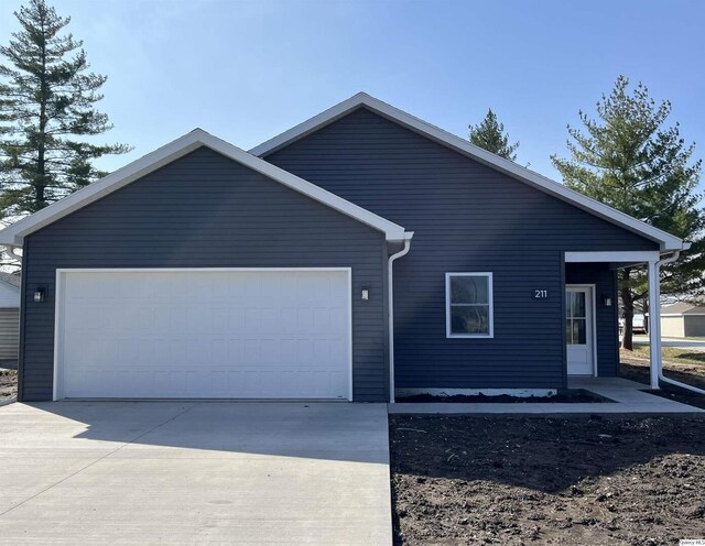 211 W Prairie St, Camp Point, IL 62320 - ranch-style home with concrete driveway and an attached garage