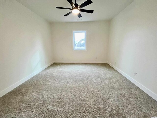 211 W Prairie St, Camp Point, IL 62320 - carpeted spare room featuring visible vents, ceiling fan, and baseboards