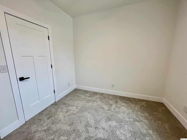 211 W Prairie St, Camp Point, IL 62320 - spare room with baseboards and carpet floors