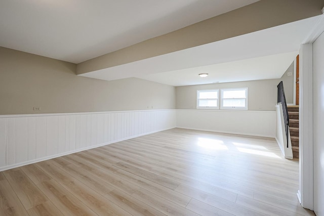 basement with light hardwood / wood-style floors