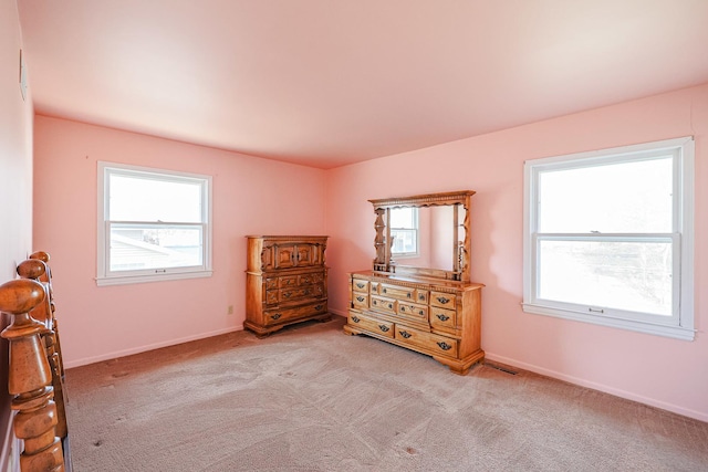 unfurnished bedroom featuring light colored carpet