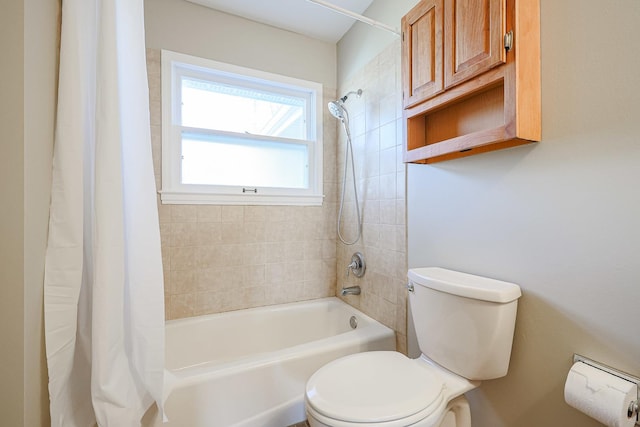 bathroom with shower / bathtub combination with curtain and toilet