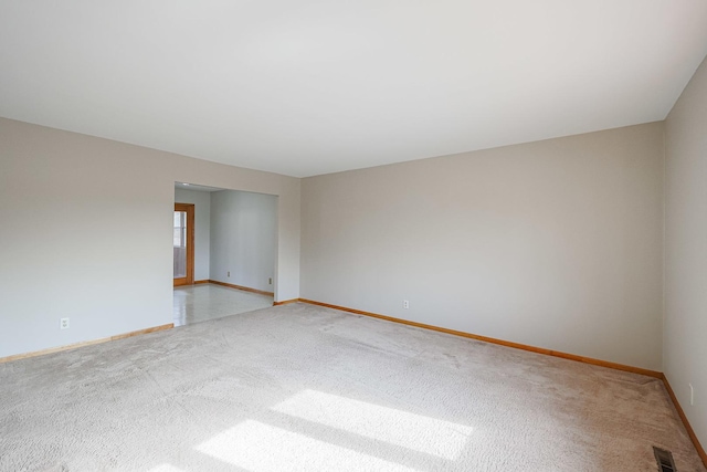 empty room featuring light colored carpet