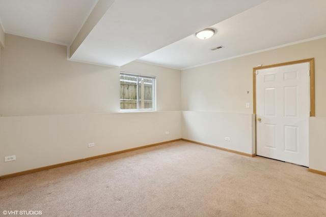 carpeted spare room with crown molding