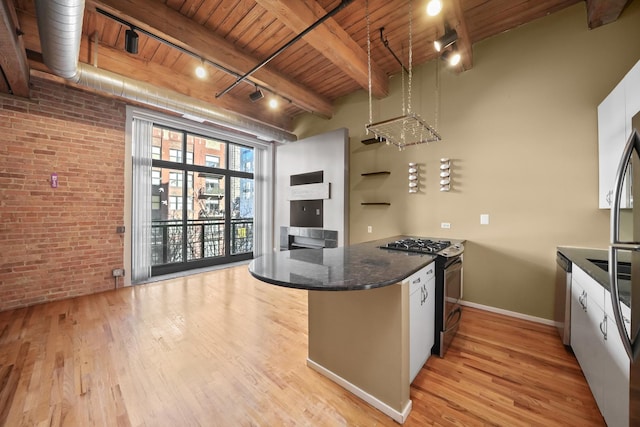 kitchen with brick wall, appliances with stainless steel finishes, white cabinets, wood ceiling, and light hardwood / wood-style flooring