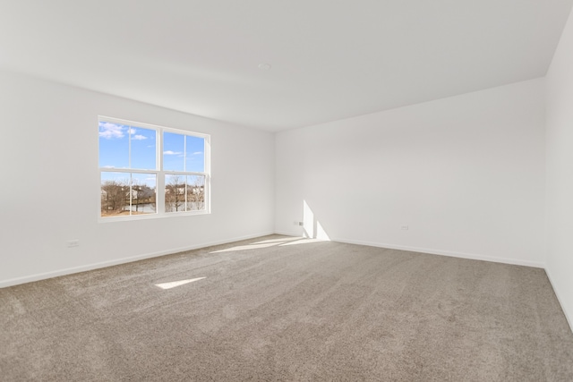 unfurnished room featuring carpet