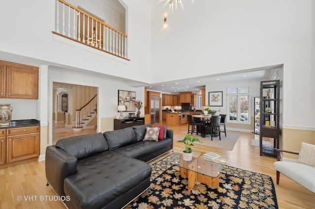 860 Gage Ln, Lake Forest, IL 60045 - living area featuring recessed lighting, a towering ceiling, baseboards, stairs, and light wood-type flooring