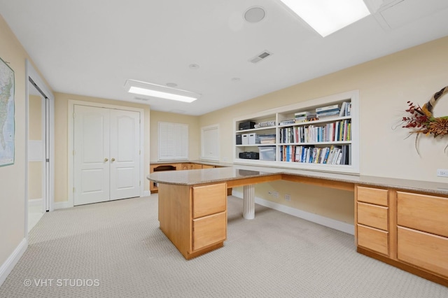 860 Gage Ln, Lake Forest, IL 60045 - office area featuring light carpet, built in study area, visible vents, and baseboards