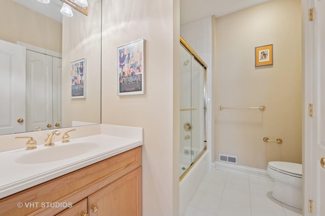 860 Gage Ln, Lake Forest, IL 60045 - bathroom with a closet, visible vents, toilet, enclosed tub / shower combo, and vanity