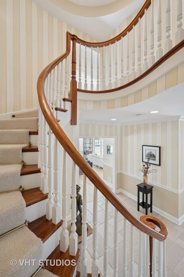 860 Gage Ln, Lake Forest, IL 60045 - stairway featuring baseboards, a high ceiling, and wallpapered walls