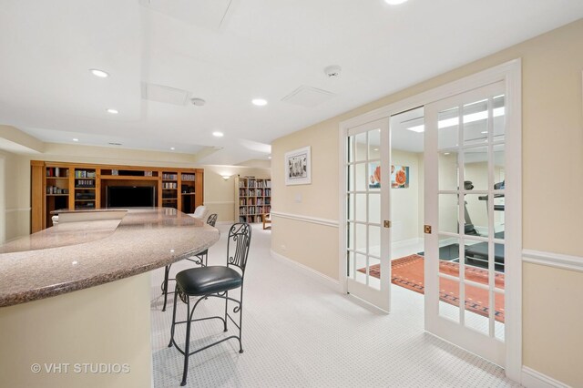 860 Gage Ln, Lake Forest, IL 60045 - kitchen with light colored carpet, open floor plan, a breakfast bar, french doors, and recessed lighting