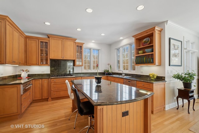 860 Gage Ln, Lake Forest, IL 60045 - kitchen with dark countertops, light wood-style floors, glass insert cabinets, and a center island