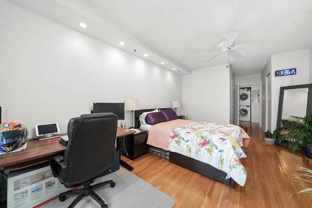 bedroom with a ceiling fan, recessed lighting, stacked washer and clothes dryer, and light wood-style flooring