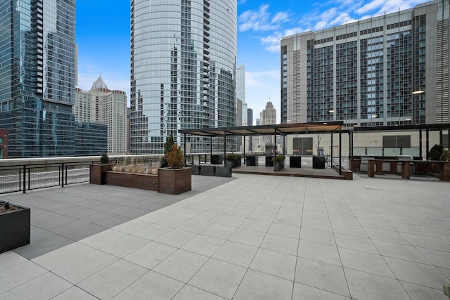 view of patio / terrace featuring a city view