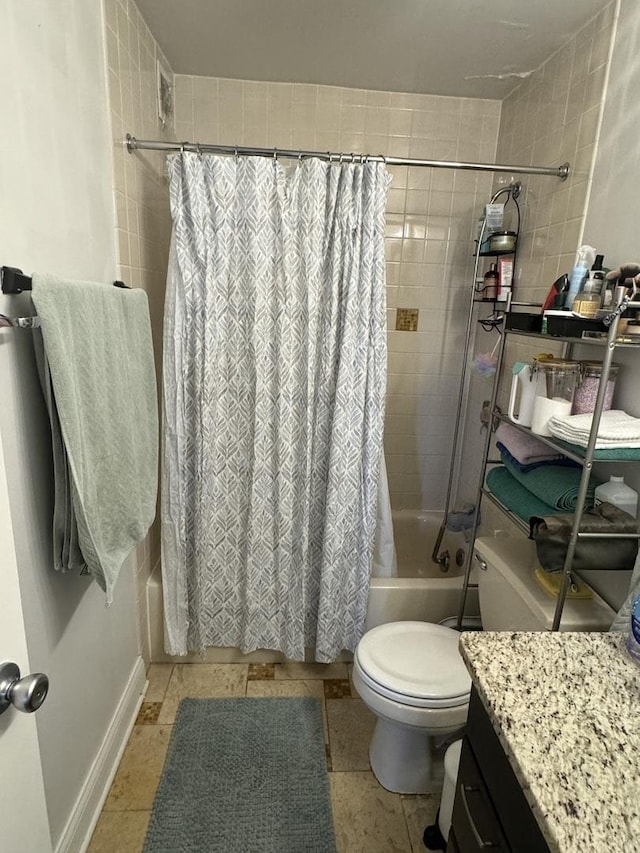 full bathroom featuring shower / bath combination with curtain, vanity, and toilet