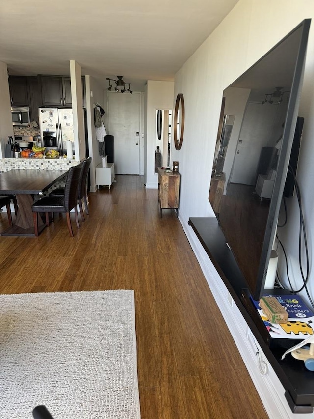 dining space with dark hardwood / wood-style floors