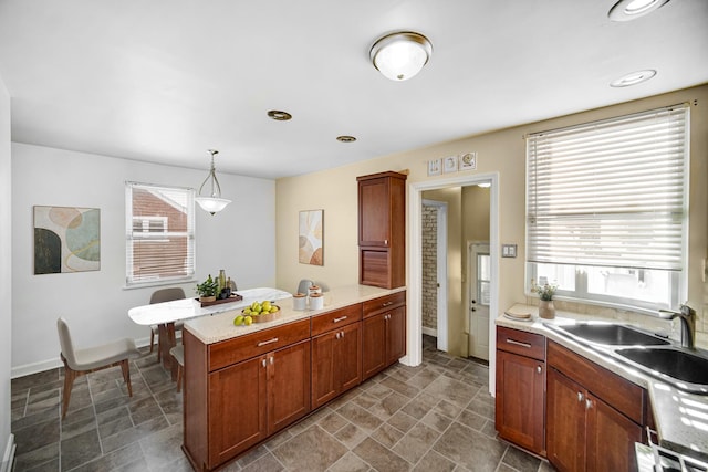 kitchen featuring sink and hanging light fixtures