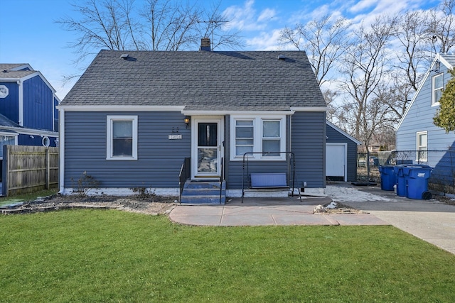 bungalow-style home with a front lawn and a patio