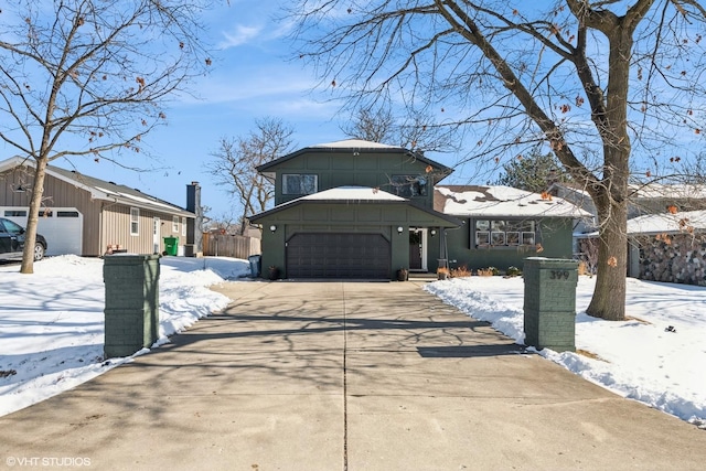 view of front facade with driveway and an attached garage