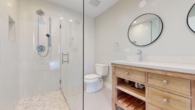 bathroom featuring visible vents, toilet, a shower stall, vanity, and tile patterned flooring