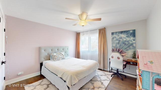 bedroom featuring ceiling fan, dark wood finished floors, and baseboards